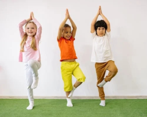three kids doing balancing exercises